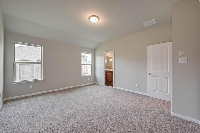 21622 Sage Landing Ln, Katy, TX 77449 - unfurnished bedroom with carpet floors, baseboards, and lofted ceiling