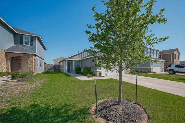 21622 Sage Landing Ln, Katy, TX 77449 - view of front of home with concrete driveway, brick siding, and a garage