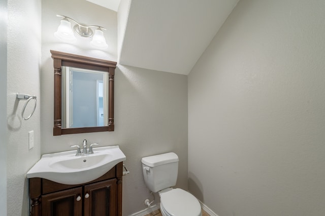 20107 Louetta Crossing Dr, Spring, TX 77388 - half bath featuring vanity, toilet, baseboards, and lofted ceiling