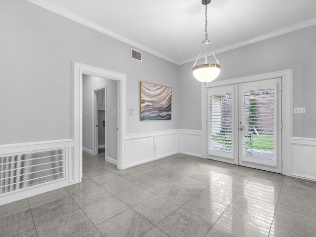 13 Hickory Shadows Dr, Houston, TX 77055 - empty room with granite tiled floors, french doors, a wainscoted wall, ornamental molding, and a decorative wall