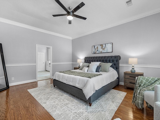 13 Hickory Shadows Dr, Houston, TX 77055 - bedroom with a textured ceiling, wood finished floors, a ceiling fan, ornamental molding, and baseboards