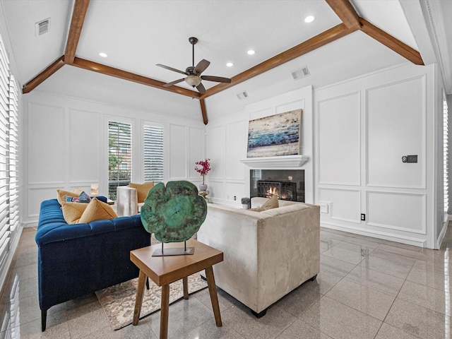 13 Hickory Shadows Dr, Houston, TX 77055 - living room featuring a decorative wall, ceiling fan, a warm lit fireplace, granite tiled floors, and recessed lighting