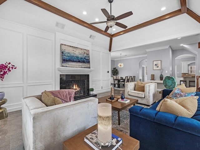 13 Hickory Shadows Dr, Houston, TX 77055 - living area with a decorative wall, arched walkways, a ceiling fan, a fireplace, and recessed lighting