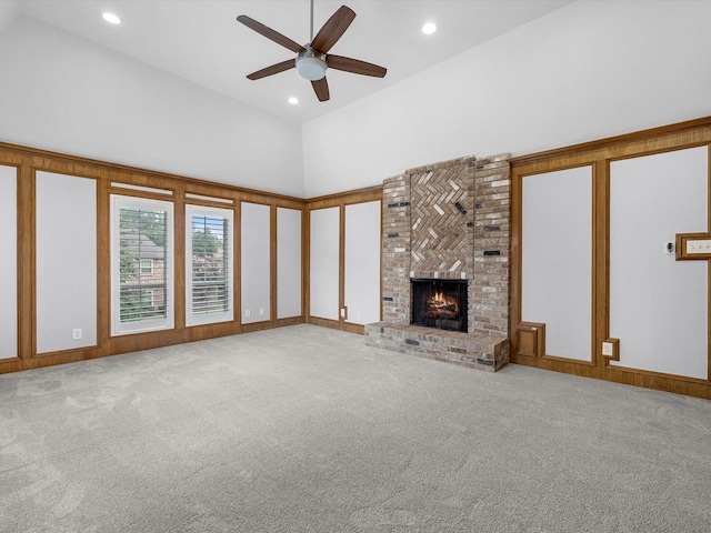 13 Hickory Shadows Dr, Houston, TX 77055 - unfurnished living room featuring ceiling fan, carpet flooring, recessed lighting, a fireplace, and a towering ceiling