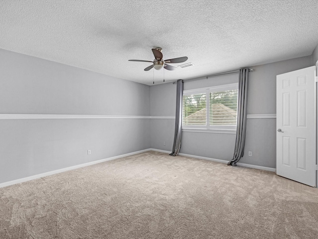 13 Hickory Shadows Dr, Houston, TX 77055 - unfurnished room with a ceiling fan, carpet, a textured ceiling, and baseboards
