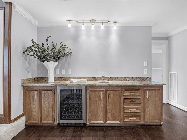 13 Hickory Shadows Dr, Houston, TX 77055 - indoor wet bar featuring beverage cooler, ornamental molding, dark wood-style flooring, and baseboards