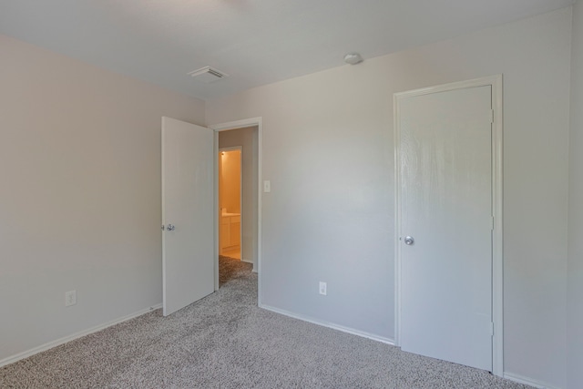 21002 Brannon Hill Ln, Humble, TX 77338 - unfurnished bedroom with carpet flooring and baseboards