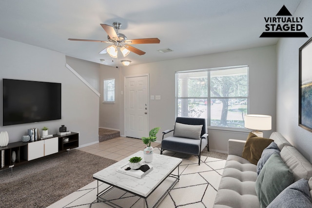 21002 Brannon Hill Ln, Humble, TX 77338 - living area with healthy amount of natural light, a ceiling fan, and baseboards