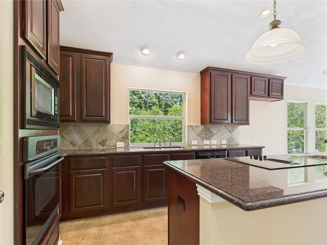 11628 King Edward Ct, Montgomery, TX 77316 - kitchen with a sink, black appliances, backsplash, and dark stone countertops