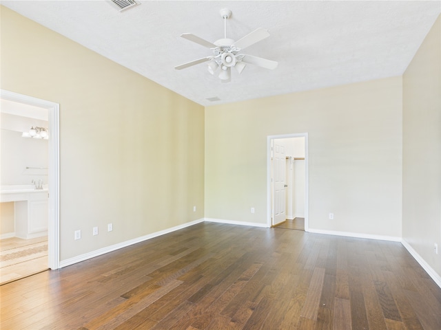 11628 King Edward Ct, Montgomery, TX 77316 - spare room with a ceiling fan, dark wood-type flooring, and baseboards