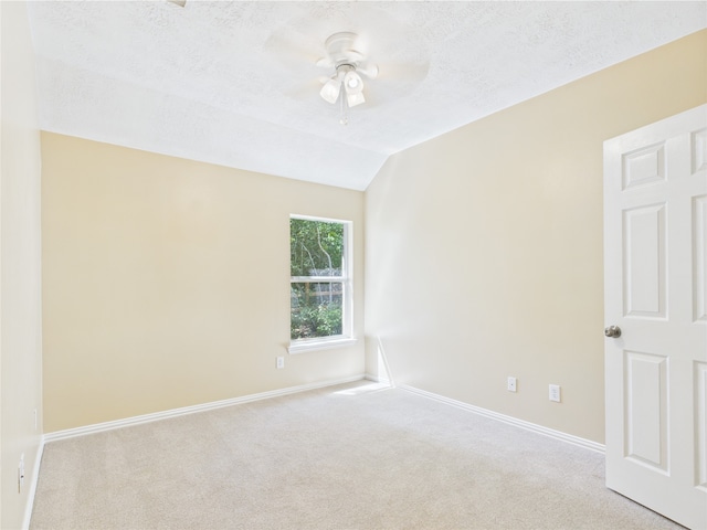 11628 King Edward Ct, Montgomery, TX 77316 - spare room with ceiling fan, carpet flooring, baseboards, a textured ceiling, and lofted ceiling