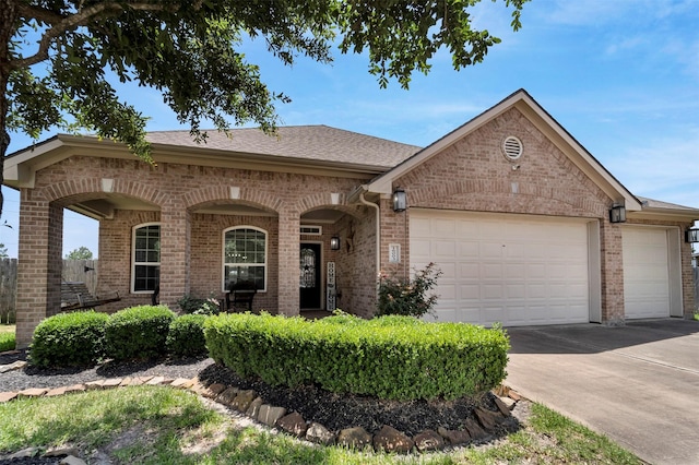 16003 Ronda Dale Dr, Hockley, TX 77447 - view of front of home featuring brick siding, an attached garage, and concrete driveway