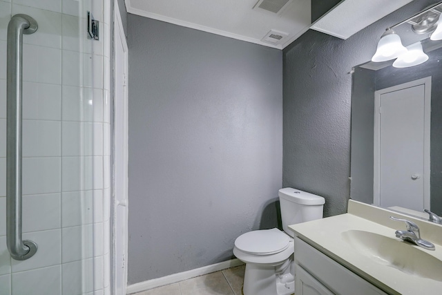 full bathroom with tile patterned floors, vanity, toilet, tiled shower, and baseboards