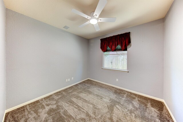 1810 Spreading Bough Ln, Richmond, TX 77406 - spare room featuring ceiling fan, carpet flooring, and baseboards