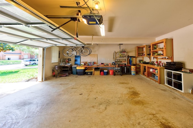 1810 Spreading Bough Ln, Richmond, TX 77406 - garage with a workshop area and a garage door opener