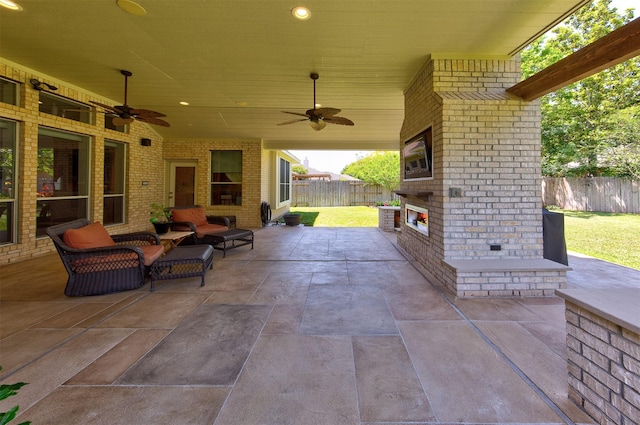 1810 Spreading Bough Ln, Richmond, TX 77406 - fenced backyard with an outdoor brick fireplace, a patio, and a ceiling fan