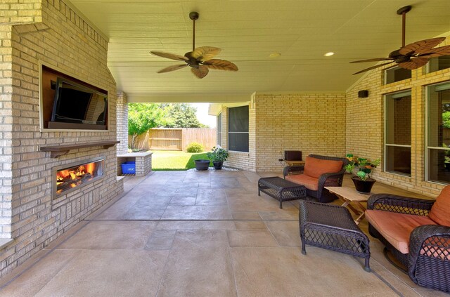 1810 Spreading Bough Ln, Richmond, TX 77406 - view of patio / terrace featuring ceiling fan and an outdoor living space with a fireplace