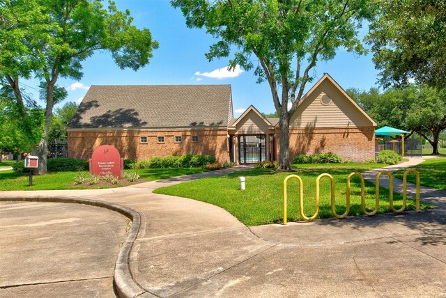 1810 Spreading Bough Ln, Richmond, TX 77406 - view of front of house with brick siding and a front yard