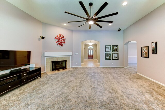1810 Spreading Bough Ln, Richmond, TX 77406 - unfurnished living room featuring arched walkways, ceiling fan, carpet, recessed lighting, and baseboards
