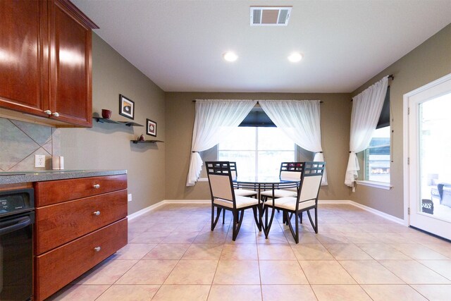 1810 Spreading Bough Ln, Richmond, TX 77406 - dining room with light tile patterned floors, baseboards, and recessed lighting