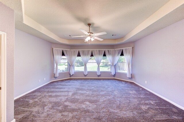 1810 Spreading Bough Ln, Richmond, TX 77406 - carpeted empty room featuring a raised ceiling, ceiling fan, a textured ceiling, and baseboards