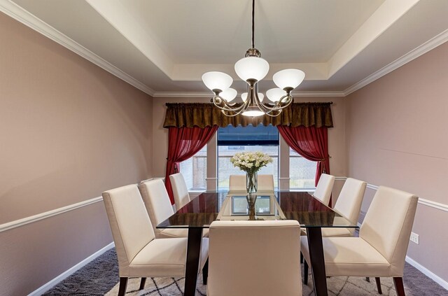 1810 Spreading Bough Ln, Richmond, TX 77406 - carpeted dining room featuring a raised ceiling, a chandelier, baseboards, and ornamental molding