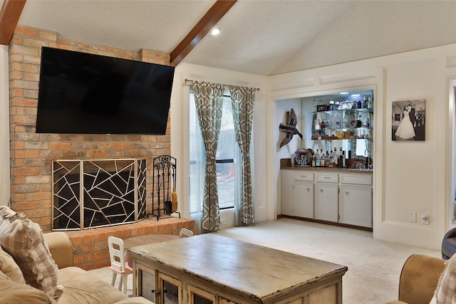 living room with a bar, light carpet, a textured ceiling, and a fireplace