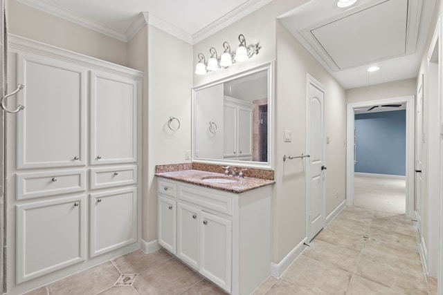 6230 Elm Heights Ln, Houston, TX 77081 - bathroom featuring tile patterned flooring, baseboards, vanity, crown molding, and recessed lighting