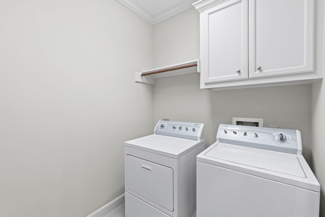 6230 Elm Heights Ln, Houston, TX 77081 - laundry room featuring washer and dryer, crown molding, and cabinet space