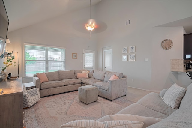 4523 Stolz Trl, Katy, TX 77493 - living area featuring high vaulted ceiling, healthy amount of natural light, a ceiling fan, and baseboards