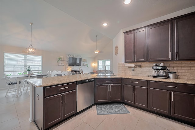 4523 Stolz Trl, Katy, TX 77493 - kitchen featuring stainless steel dishwasher, lofted ceiling, a peninsula, backsplash, and a chandelier