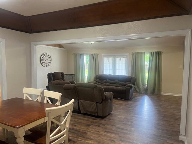 13375 Craig Ln, Bevil Oaks, TX 77713 - dining room with dark wood-type flooring, plenty of natural light, and vaulted ceiling