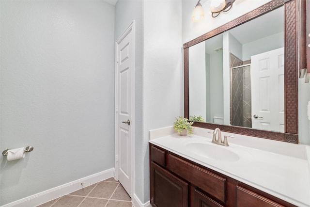 27259 Jessica Hills Ln, Spring, TX 77386 - bathroom featuring an enclosed shower, vanity, baseboards, and tile patterned floors