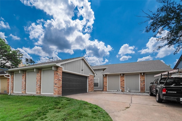 19411 Southaven Dr, Houston, TX 77084 - view of front of house with concrete driveway, brick siding, a front yard, and a garage