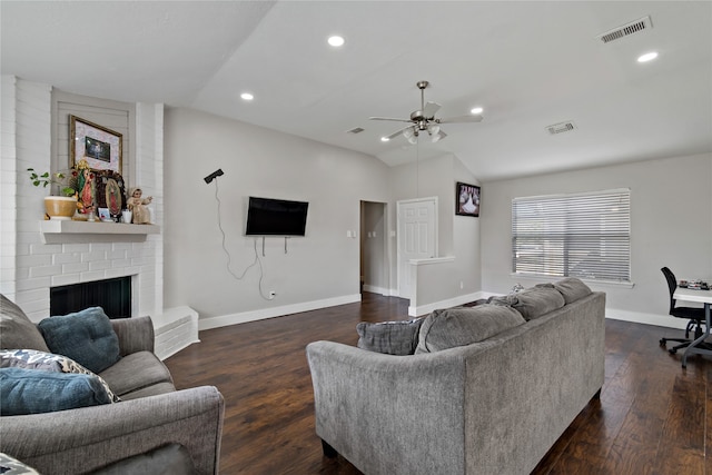 19411 Southaven Dr, Houston, TX 77084 - living room featuring vaulted ceiling, a ceiling fan, dark wood-style flooring, baseboards, and a fireplace