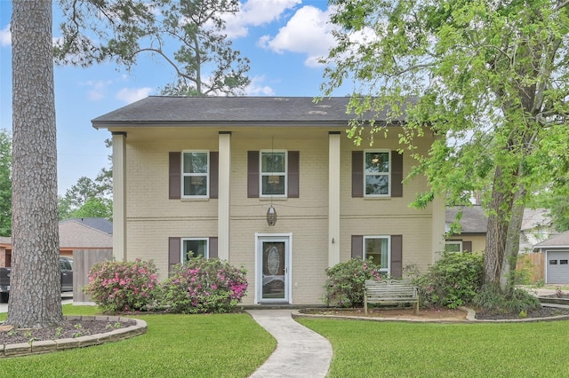 16419 Fox Crossing Ln, Spring, TX 77379 - view of front of home featuring a front yard and brick siding