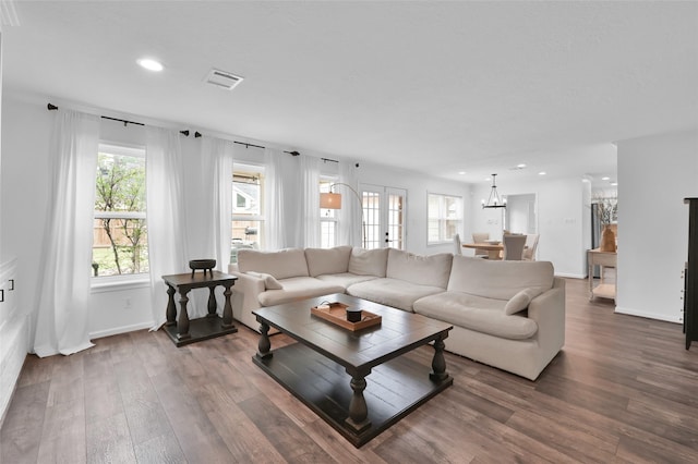 16419 Fox Crossing Ln, Spring, TX 77379 - living area featuring recessed lighting, wood finished floors, a chandelier, and baseboards