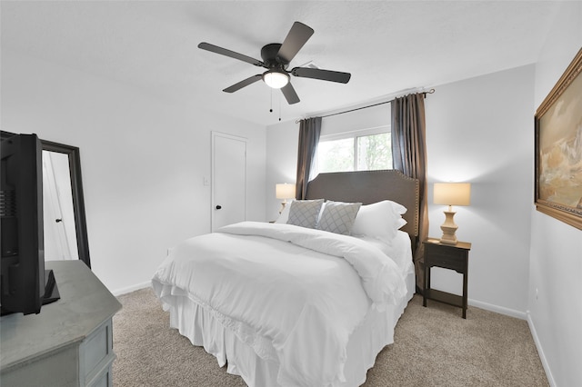 16419 Fox Crossing Ln, Spring, TX 77379 - bedroom featuring light colored carpet, baseboards, and ceiling fan