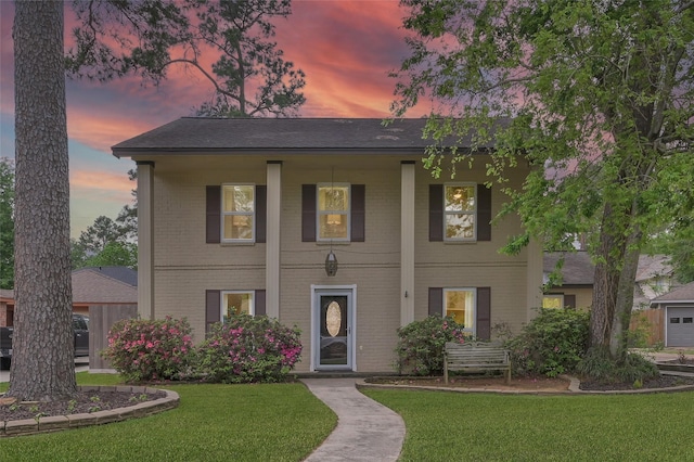 16419 Fox Crossing Ln, Spring, TX 77379 - view of front of home with a lawn and brick siding