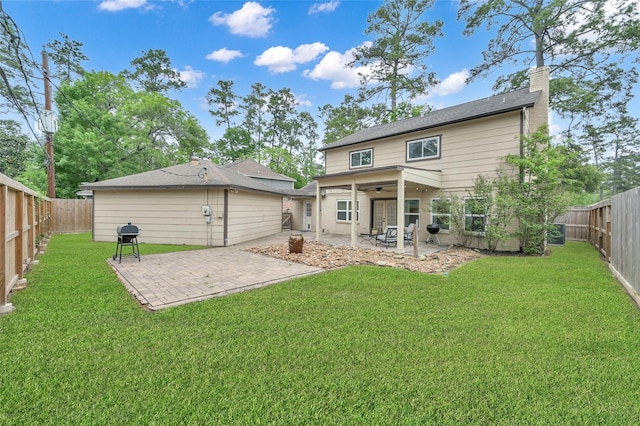 16419 Fox Crossing Ln, Spring, TX 77379 - rear view of house with a patio area, ceiling fan, and a chimney