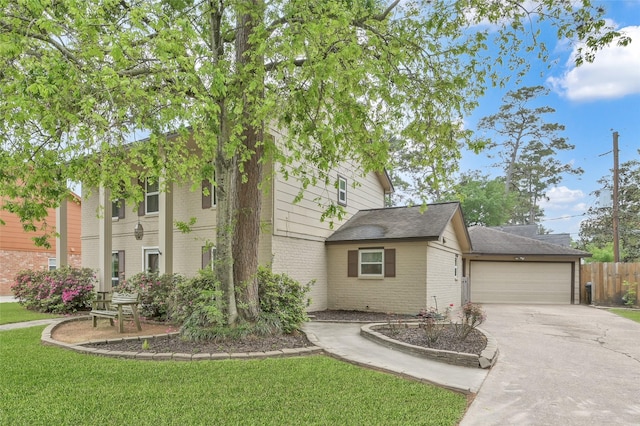 16419 Fox Crossing Ln, Spring, TX 77379 - view of front of property with brick siding, concrete driveway, and a garage