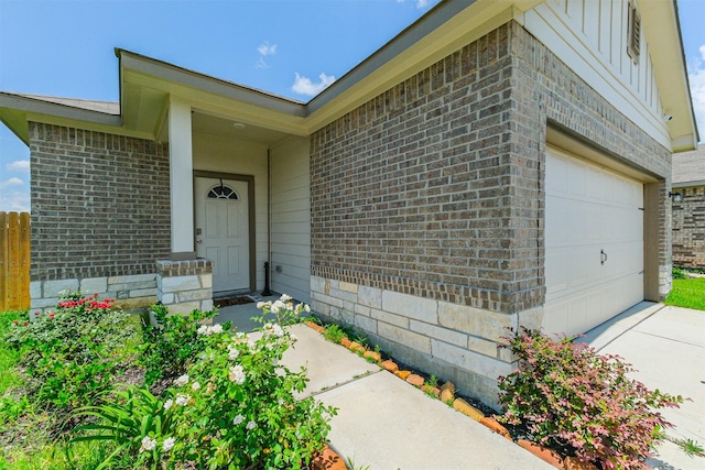 14657 E Pine Heart Dr, Conroe, TX 77302 - doorway to property with brick siding, driveway, and an attached garage