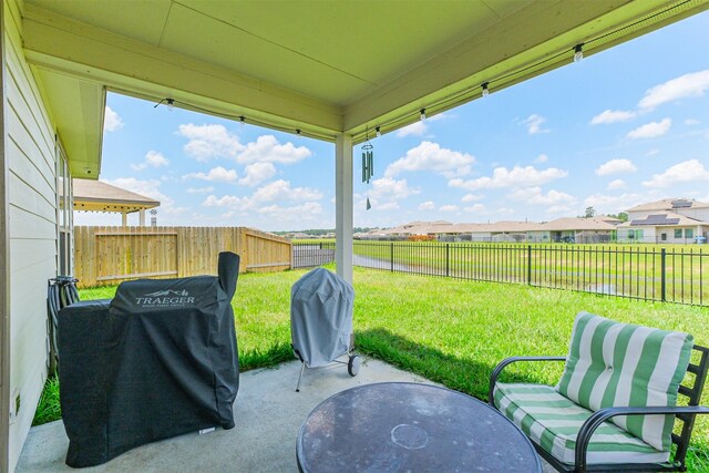 14657 E Pine Heart Dr, Conroe, TX 77302 - view of patio with a grill and a residential view