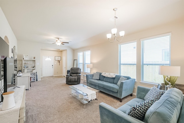 14657 E Pine Heart Dr, Conroe, TX 77302 - carpeted living room with a chandelier, a ceiling fan, and baseboards