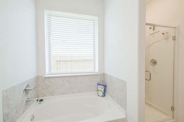 14657 E Pine Heart Dr, Conroe, TX 77302 - full bathroom featuring a stall shower and a bath
