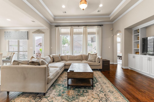 2322 Dolan Springs Ln, Friendswood, TX 77546 - living area with plenty of natural light, wood finished floors, crown molding, and arched walkways