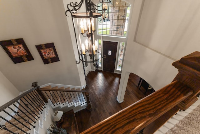 2322 Dolan Springs Ln, Friendswood, TX 77546 - entrance foyer featuring wood finished floors, a chandelier, baseboards, stairway, and a towering ceiling