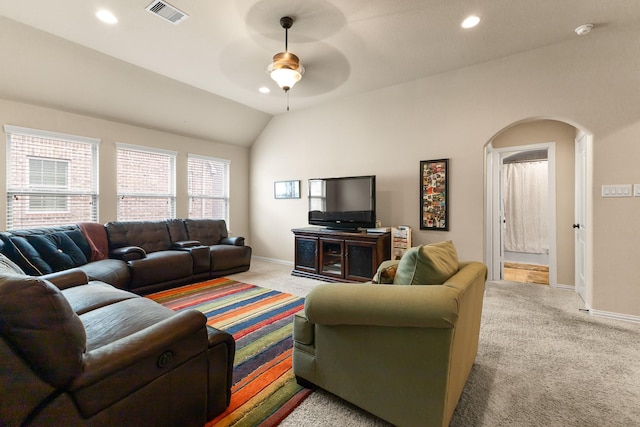 2322 Dolan Springs Ln, Friendswood, TX 77546 - living room with carpet flooring, ceiling fan, baseboards, vaulted ceiling, and arched walkways