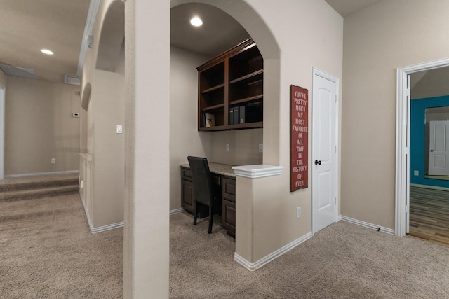 2322 Dolan Springs Ln, Friendswood, TX 77546 - home office with light carpet, baseboards, built in study area, recessed lighting, and arched walkways