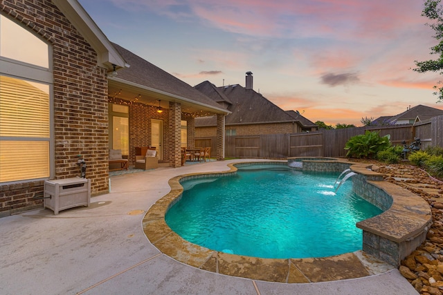 2322 Dolan Springs Ln, Friendswood, TX 77546 - view of swimming pool featuring a patio, a fenced backyard, and a pool with connected hot tub